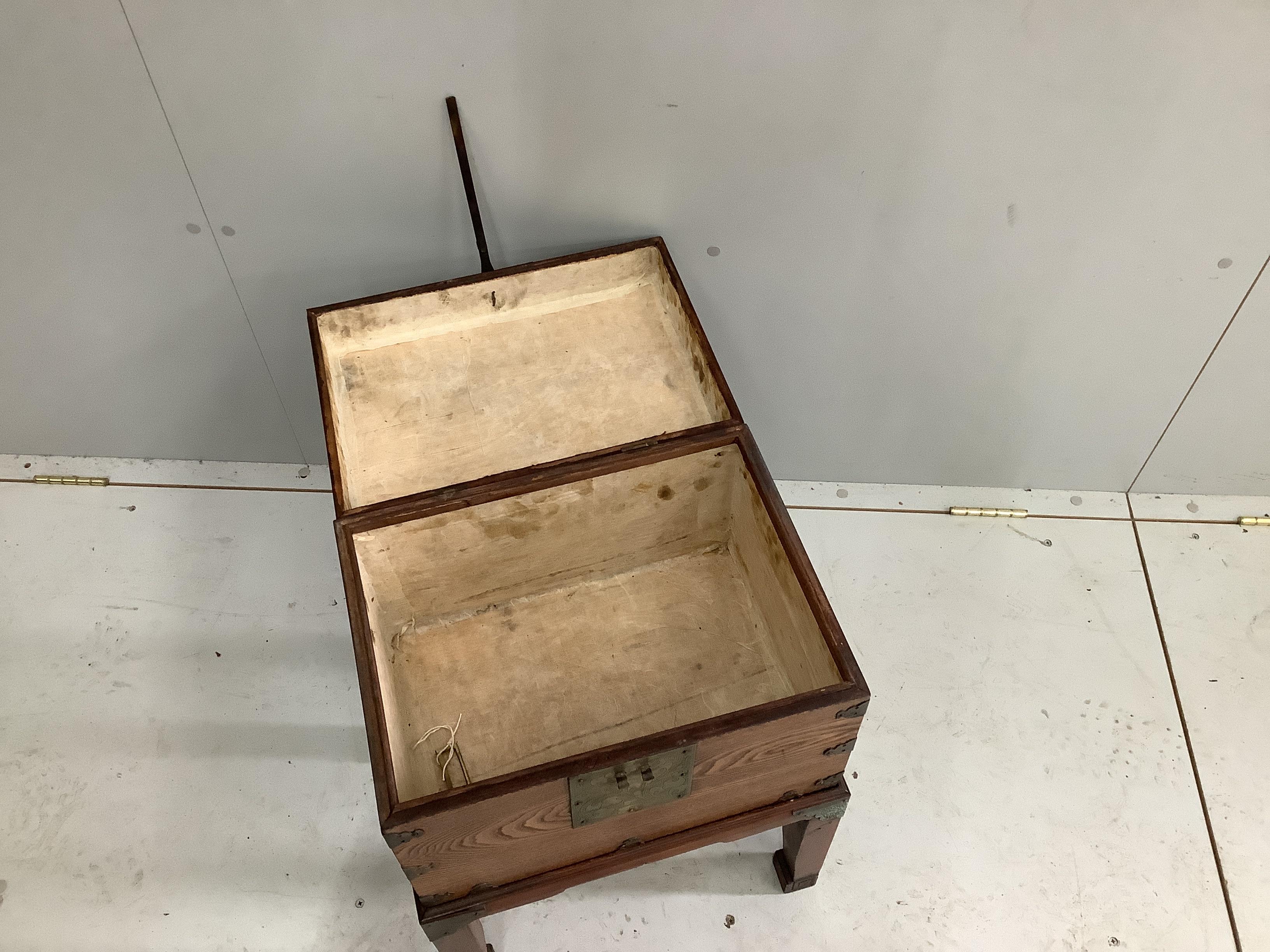 A Chinese brass mounted elm box on stand, width 42cm, depth 32cm, height 59cm